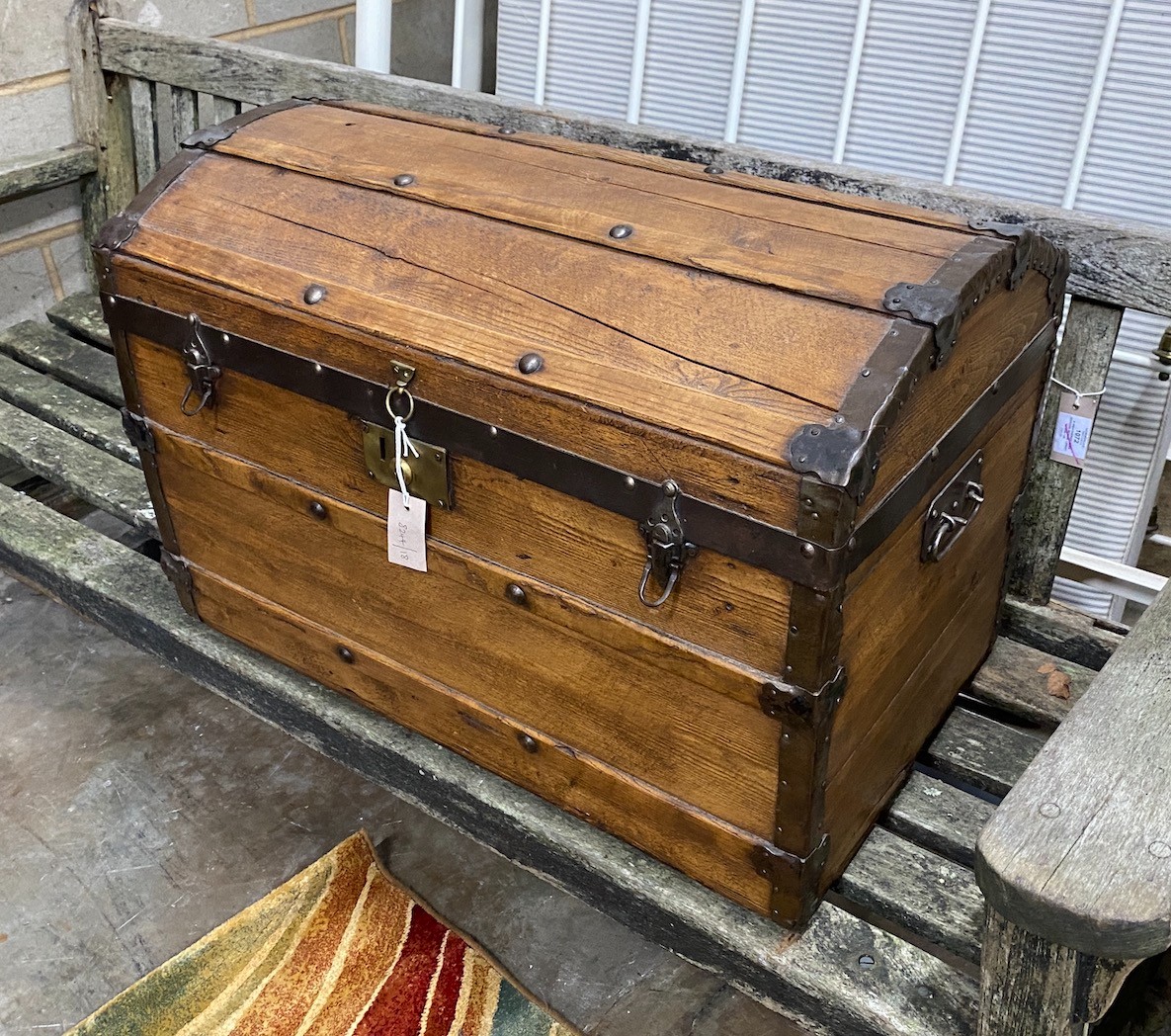 A Victorian metal bound domed top trunk, width 76cm, depth 44cm, height 52cm